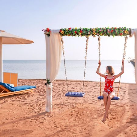 Pickalbatros Laguna Club Resort Sharm El Sheikh Екстериор снимка A swing at the beach
